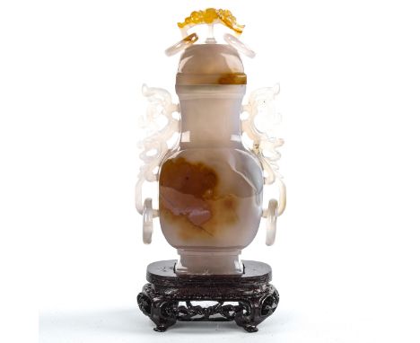 A Chinese jade/agate square-section vase and cover, carved from a single piece of hardstone, with integral pierced and scroll