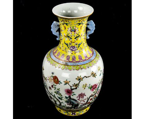 A Chinese white glaze porcelain vase, finely painted enamel flowers with yellow ground neck, seal mark, height 29.5cm 