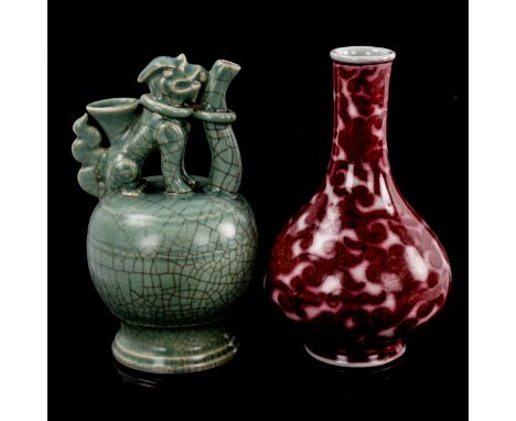 A Chinese red glaze narrow-neck vase with scroll decoration, 6 character mark, height 20cm, and a celadon crackle glaze ewer 