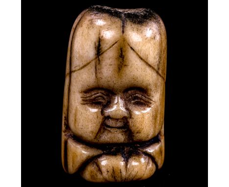 A carved staghorn netsuke of Fukurokuju, height 38mm 