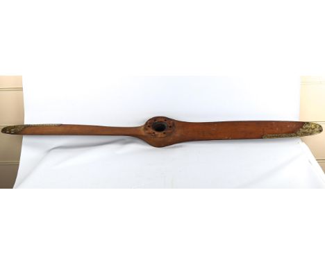 A First World War Period wood aircraft propeller with brass mounts, length 153cmNo impressed marks or numbers, brass tips hav