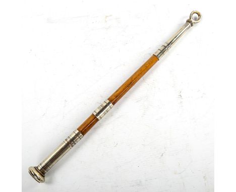 A military swagger stick, wood with white metal mounts, understood to have been owned by Frank Russell (1883 - 1951), Lieuten