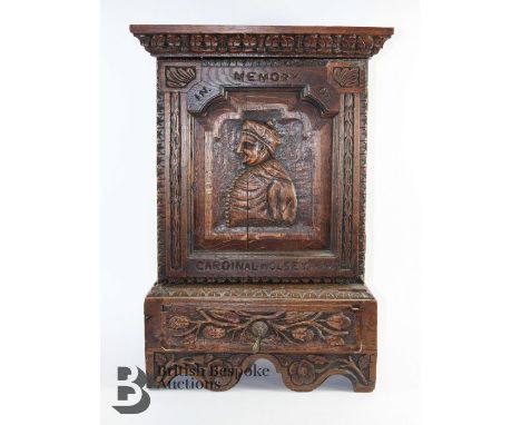 Carved oak chest. The single door having a carved surround enclosing a portrait of Cardinal Wolsey "In Memory of Cardinal Wol