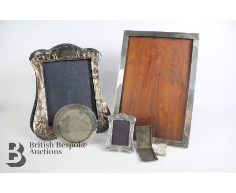 Four silver photo frames, including small circular photo frame 12 cms diameter with damaged easel; small rectangular frame st