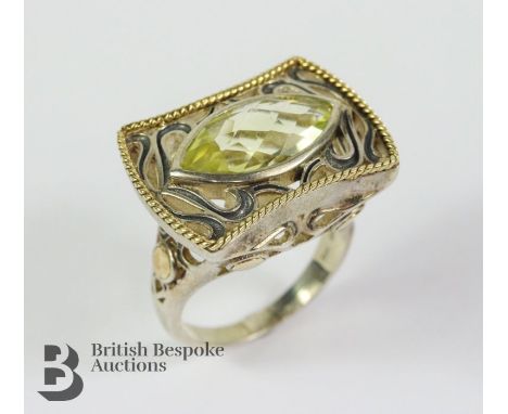 Silver and 18ct yellow gold lemon quartz ring, size R, approx 10.53 gms.&nbsp;