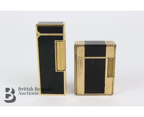 Dunhill 'Rollaga's' lighter, boxed with booklet, black enamel and plate, together with a&nbsp;SJ du Pont black enamel and gol