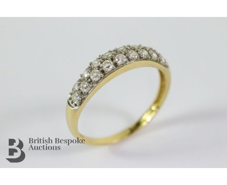 18ct yellow gold and cubic zircon ring, size T. The ring set with two rows of cubic zircon, 2.76 gms.&nbsp;