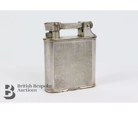 Dunhill stainless steel lighter, having an engine-turned case, patent nr 390107, measuring 50 x 45 mm.&nbsp;