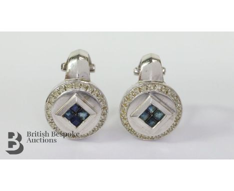 Pair of 14ct white gold sapphire and diamond earrings, 7.2 gms. The earrings set with eight square-cut sapphires of 2mm, surr