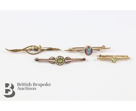 Four 9ct gold pin brooches, including a 9ct black opal 9 x 7mm, white opal (steel pin) 3mm, green stone (paste) and seed pear