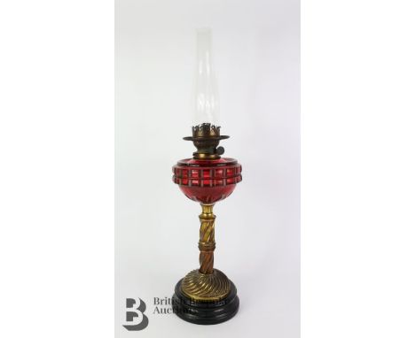 Late Victorian Palmer &amp; Co glass oil lamp with cranberry reservoir, approx 48 cms measurement including the glass funnel,