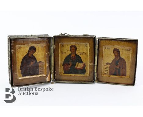 19th century Eastern European brass triptych. The exterior of the folding triptych is heightened with enamel decoration, divi