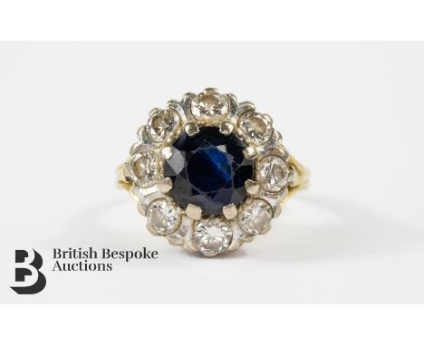 18ct gold sapphire and diamond ring. The ring set with an oval sapphire approx 7.8mm surrounded by 1ct of dias, size P, appro