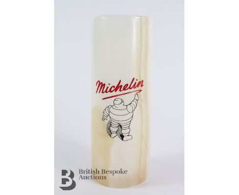 A vintage veined marble desk vase to promote Michelin Tyres, showing Monsieur Bibbendum signing the Michelin script, approx 2