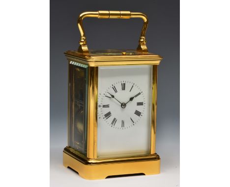 A French carriage clock with white enamel Roman dial, platform lever escapement striking the hours and half hours on a coiled