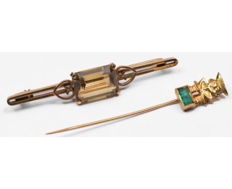 Bar brooch with citrine setting of stylised form together with a further yellow metal stick pin with Aztec character finial