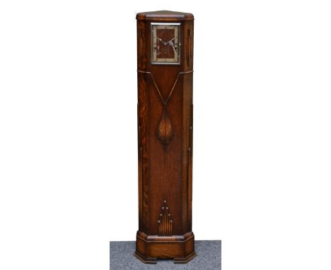 An Art Deco oak corner grandmother clock with rectangular Roman chapter ring, chime/silent lever and Norland rod chiming move