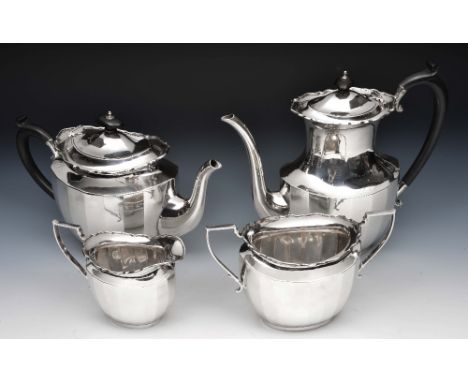 Silver four piece tea and coffee set comprising a teapot, a coffee pot, a sugar basin and milk jug of canted baluster form wi