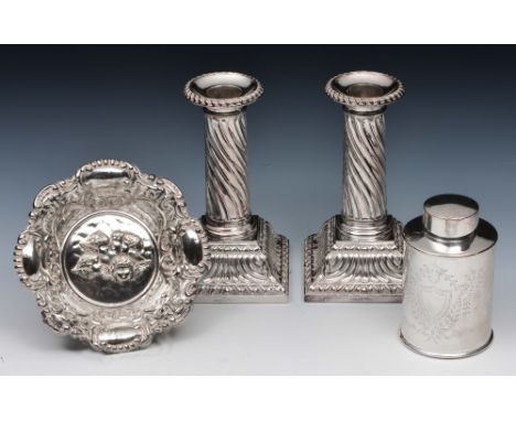 Pair of silver plated candlesticks with fluted stems and square cut bases, together with a silver plated tea caddy of cylindr