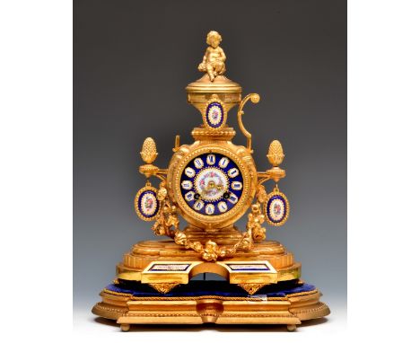 A 19th Century French gilt metal mantel clock, the blue ground porcelain dial with Roman chapters, Vincenti drum movement wit