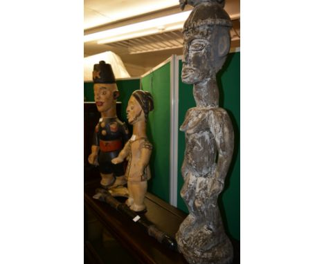 Large carved wood tribal figure 82cm, a tribal axe with horn axe head and two other carved and painted figures, 65cm high lar