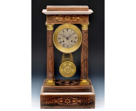 A 19th Century French rosewood portico mantel clock with silvered engine turned Roman dial, the movement with outside count w