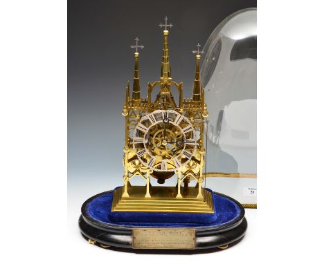 A Victorian Lichfield Cathedral brass skeleton clock, the pierced and silvered chapter ring with Roman numerals, twin chain f