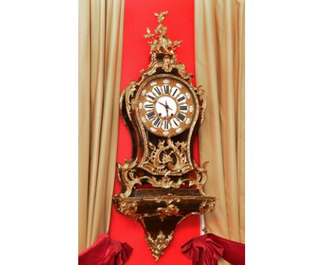 A 19th Century Louis XV style large bracket clock, the cast gilded dial with black and white enamel Roman chapters and simila