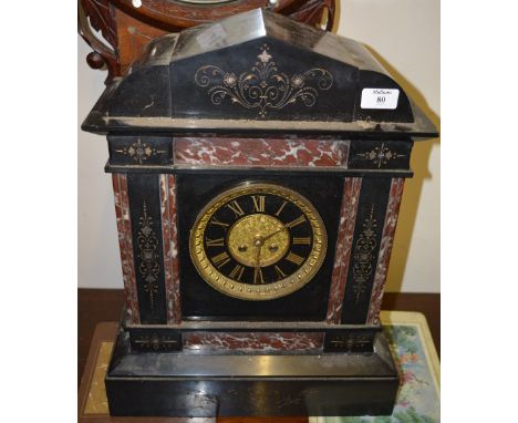 A 19th Century French polished slate and rouge marble mantel clock, the dial with gilt Roman chapters and twin train Marti mo