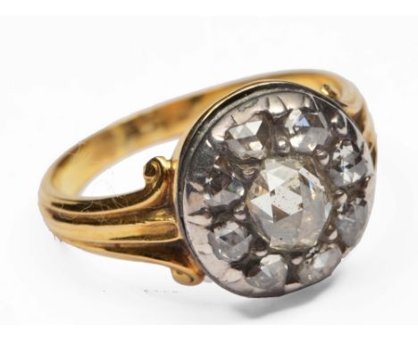 Georgian ring unmarked shank, set with central old cut diamond surrounded by eight further old cut white diamonds