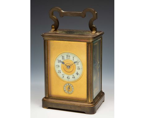 A French carriage clock the gilt dial with Gothic enamel chapter ring over a subsidiary alarm ring, silvered platform lever e