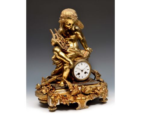 A 19th Century French gilt metal mantel clock with white enamel Roman dial, twin train Japy movement with bell strike, the fi