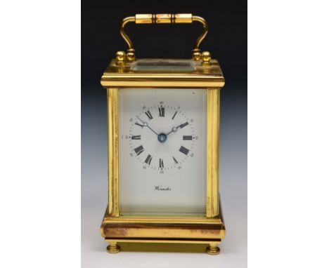 Brass carriage clock with enamel dial and loop handle