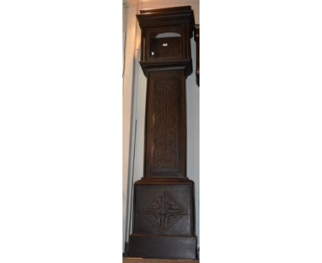 An antique carved oak longcase clock case with foliate decoration, 209cm high, together with a 12" square brass dial signed J