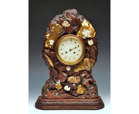 A 19th Century Japanese hardwood mantel clock the circular ivory dial with gilt Chinese zodiac chapters and Vincenti twin tra