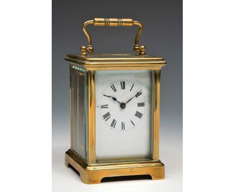 A French brass carriage timepiece with white enamel Roman dial, platform cylinder escapement and obis case, 11cm high