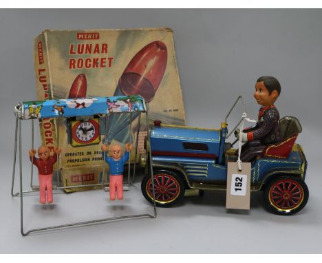 A tin plate car and driver toy, a Merit Lunar rocket boxed, and another plate toy