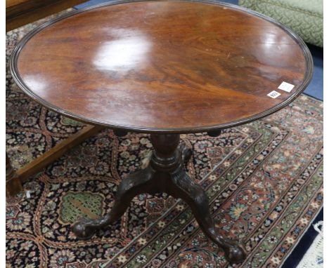 A George III mahogany tea table, with dished top and acanthus carved tripod, W.85cm