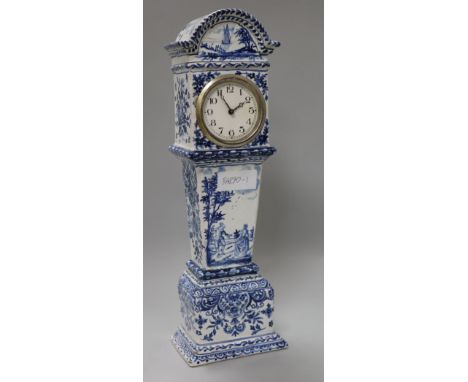 A Continental tinglazed pottery model of a longcase clock