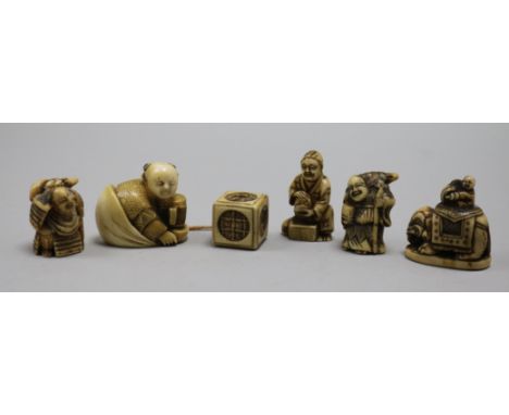 Five Japanese netsuke, one signed, and a cube toggle