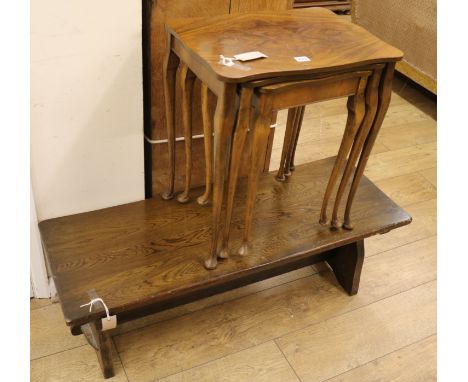 An Ercol coffee table and a nest of three walnut tea tables, W.107cm. Nest W.50cm