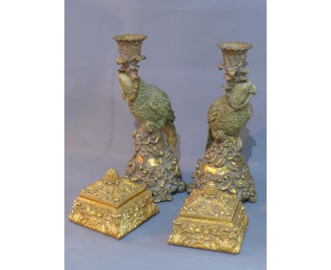 A pair of parrot candlesticks, H.31cm, together with a pair of gilt trinket boxes, with floral decoration and pineapple finia