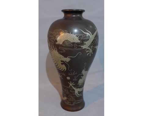 A Chinese high shouldered vase, decorated with dragons chasing a flaming pearl, H.35cm 