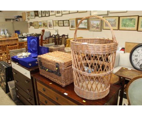 A wicker picnic hamper lacking contents and a wicker log basket 