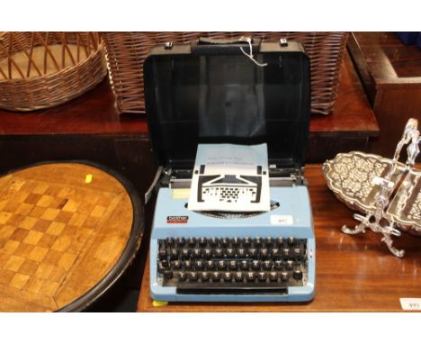 A Brother 210 typewriter in fitted case, with a portable typewriter instruction manual