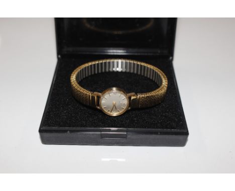 A ladies Tissot gold cased wrist watch 