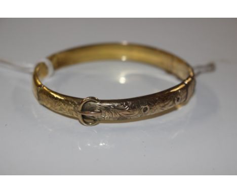 A 9ct gold buckle snap bangle, approx. total weight 9gms 