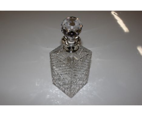 A square cut glass spirit decanter with silver collar 