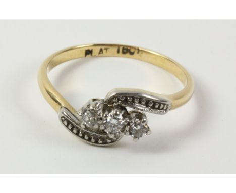 Three stone diamond twist ring stamped plat18ct   Condition Report   Click here for further images, condition, auction times 