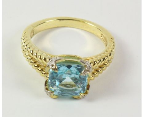 Sky blue topaz silver-gilt ring with rope twist shoulders stamped 925   Condition Report   Click here for further images, con